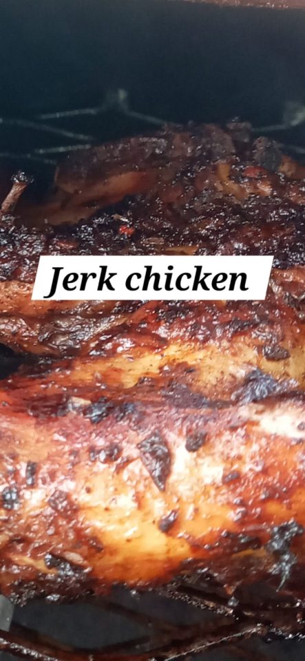 Grilled jerk chicken with a charred and flavorful glaze.